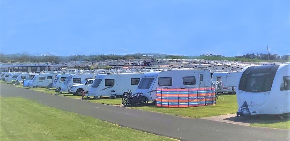 Touring caravans along the clifftop road