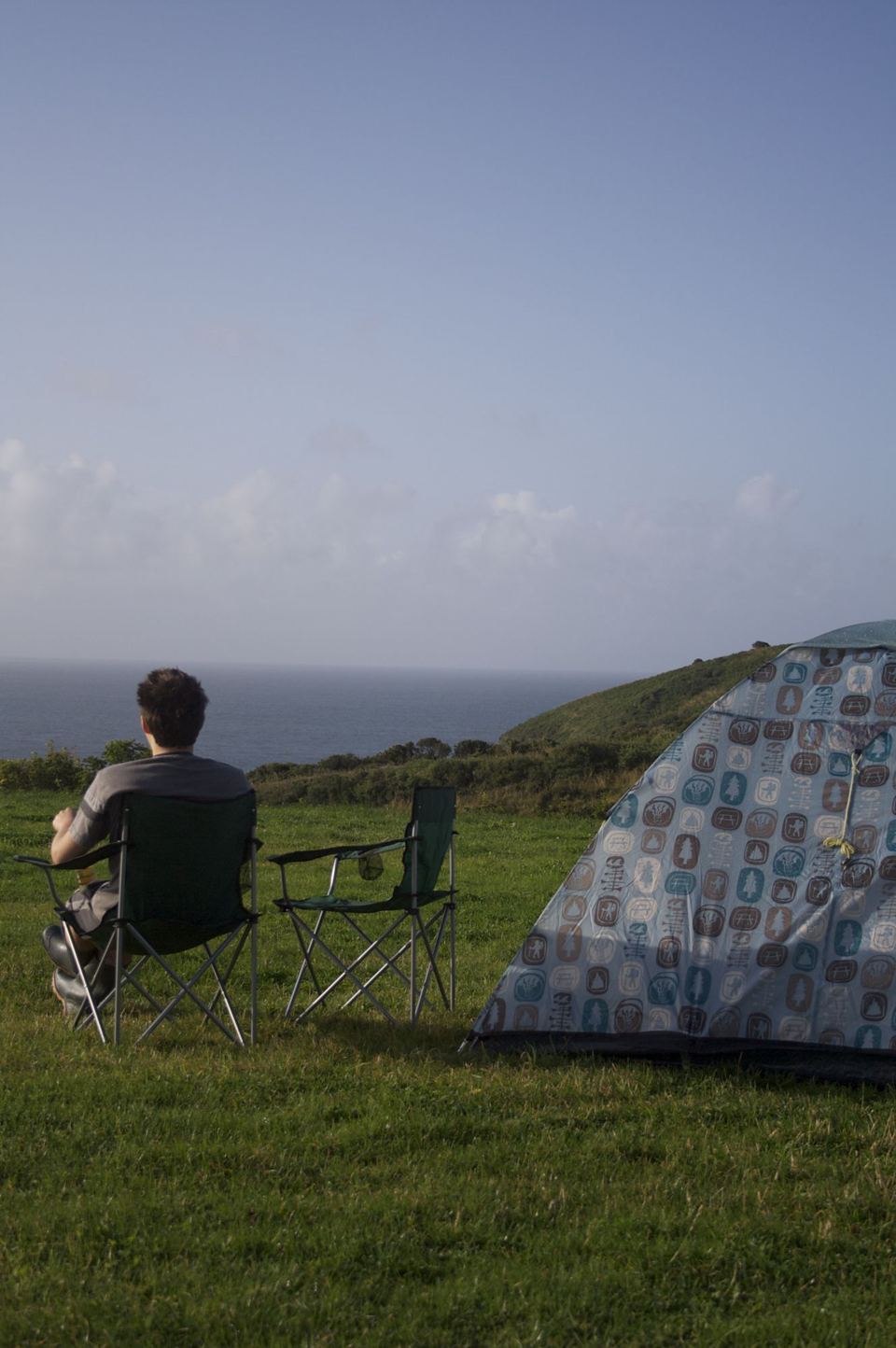 Tent on the clifftop grass