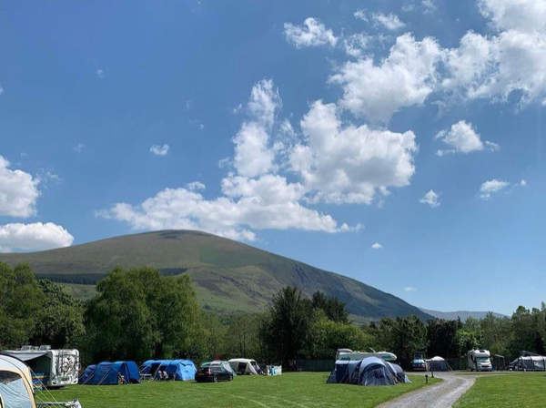 Tents and vans below the mountain