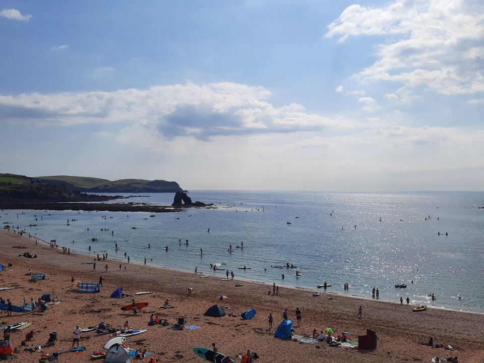 Busy sandy beach in the sun