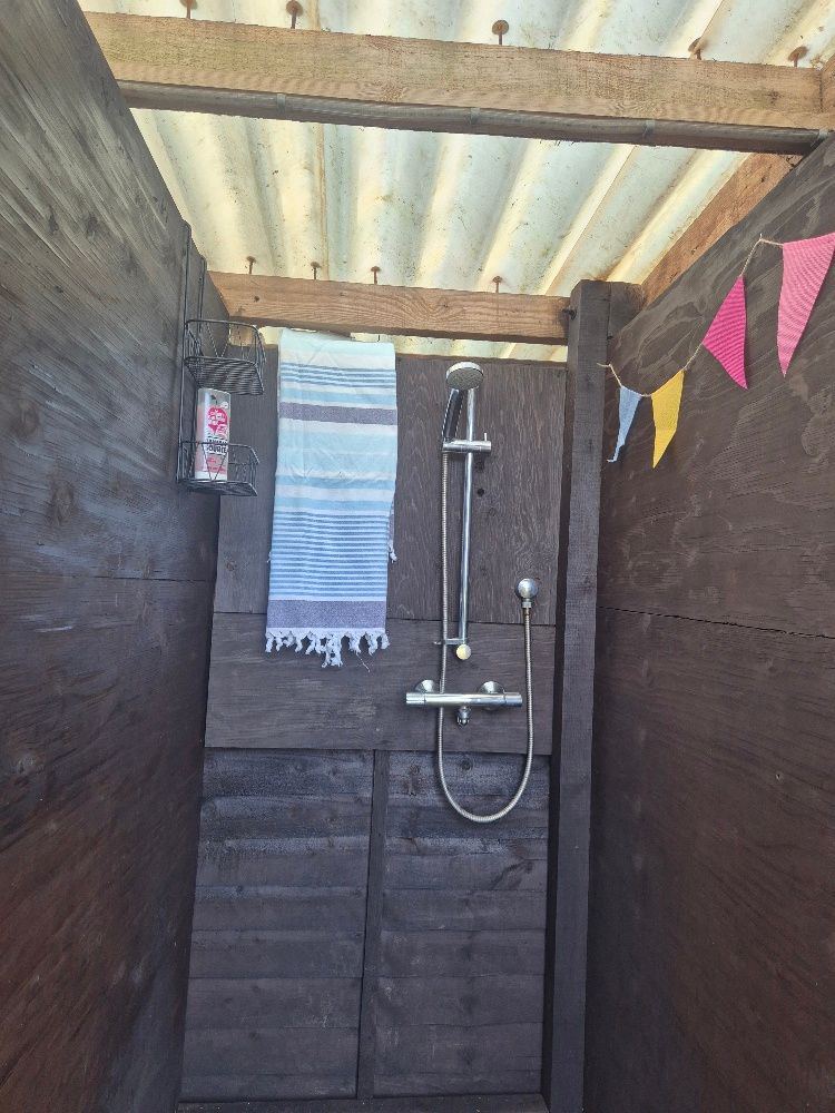 Outdoor shower with bunting