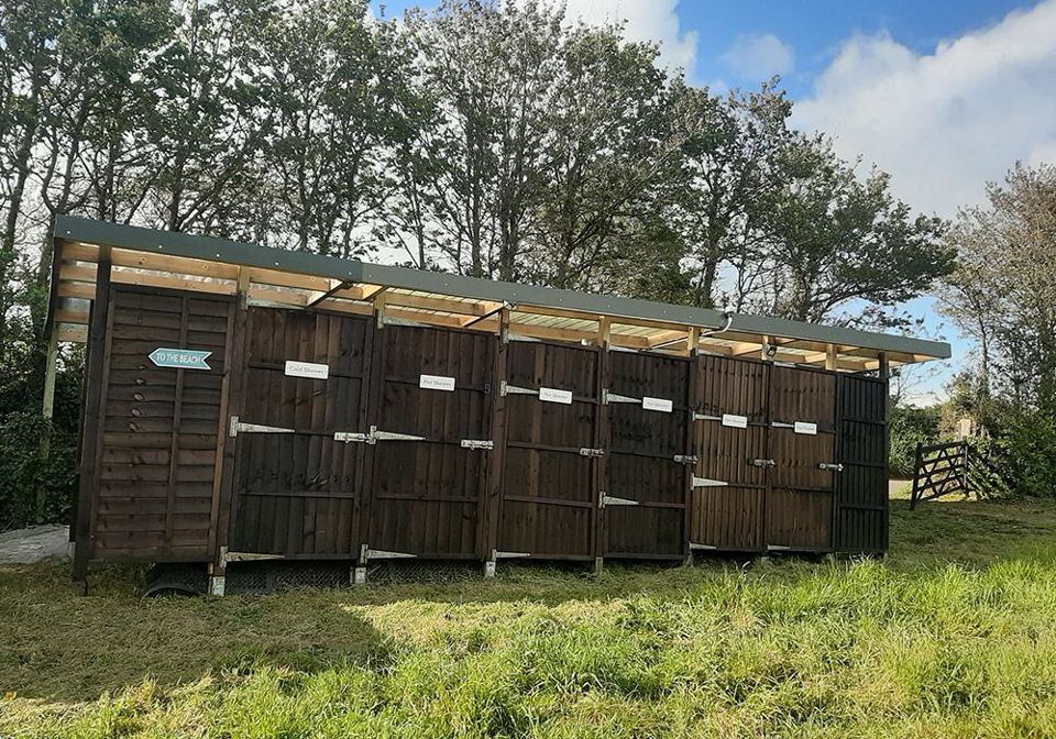 Wooden toilet block on the grass