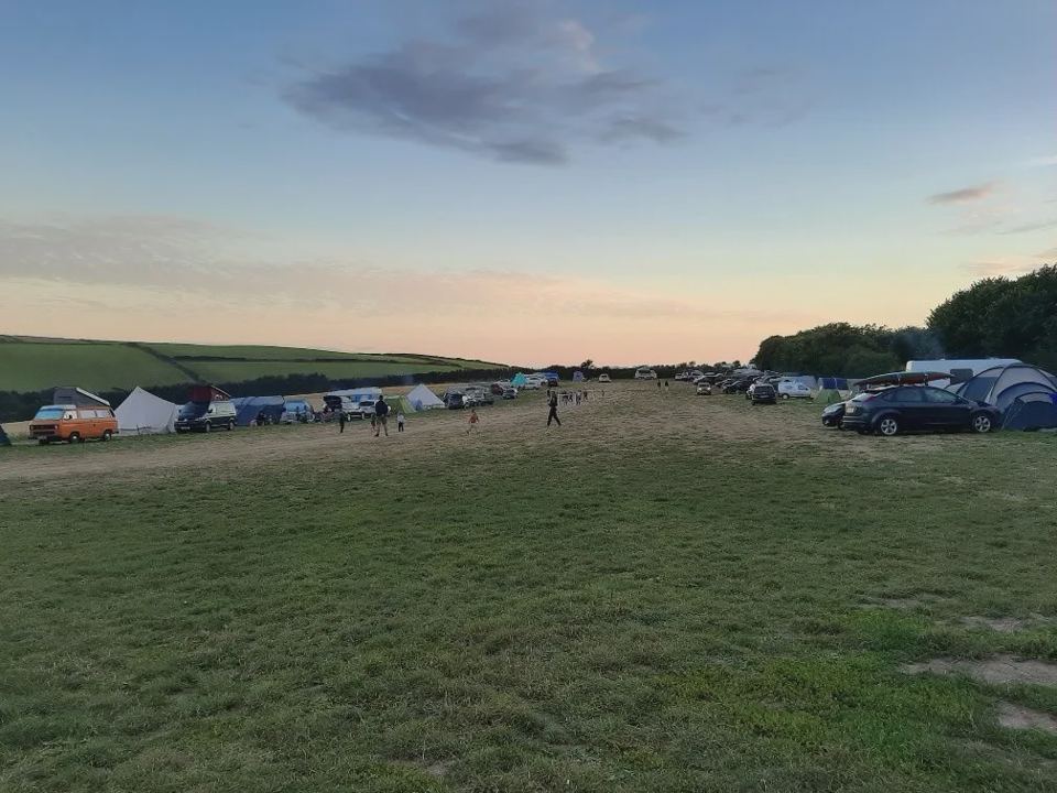 Tents on the grass at dusk
