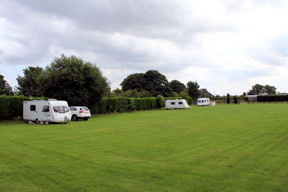 Caravans by the hedge