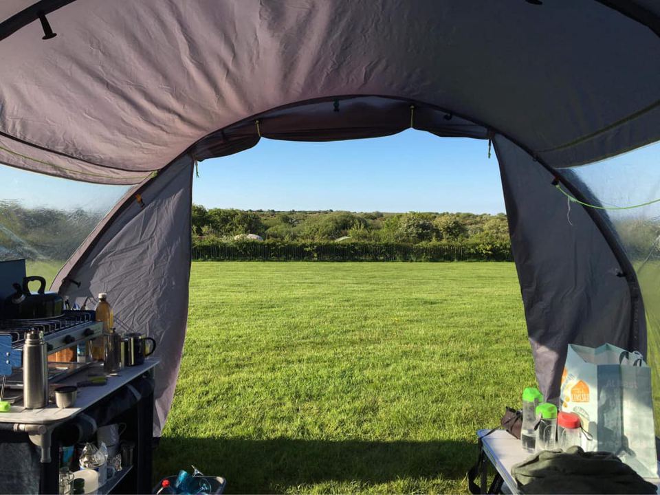 View from inside the tent over the field