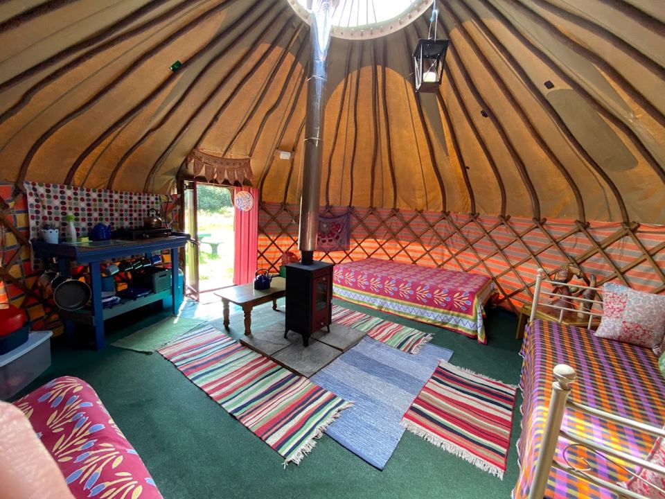 Inside the yurt with rugs