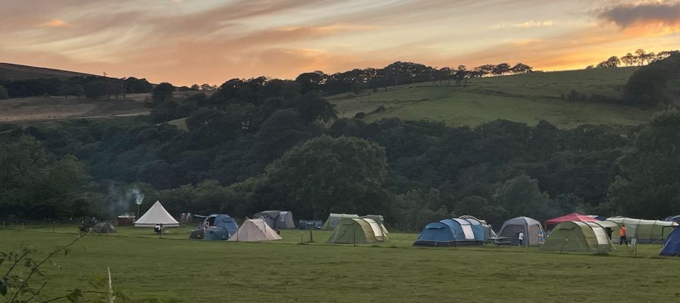 Tent field at sunset