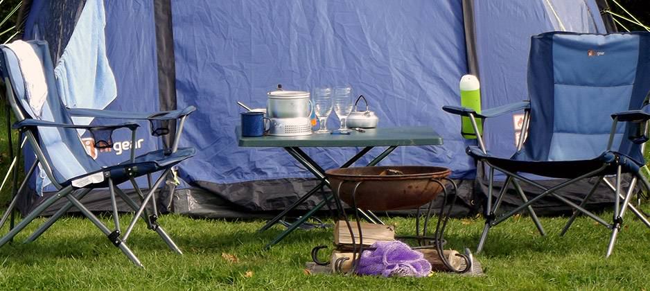 Tent set up with a fire bowl