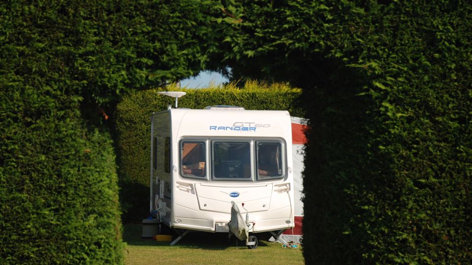 Caravan in a hedge bay