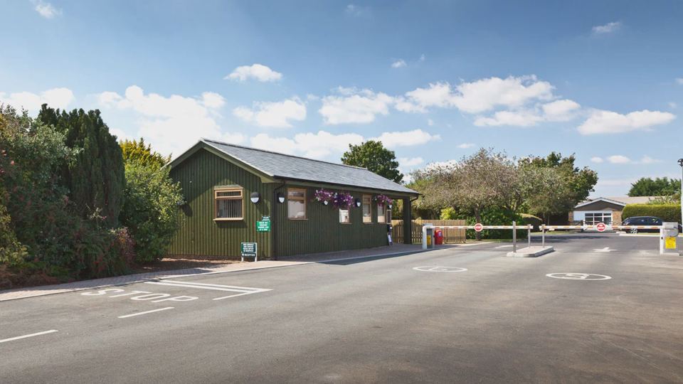 Reception building and barrier