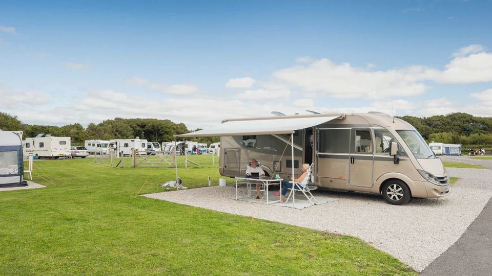 Motorhome with awning on grass