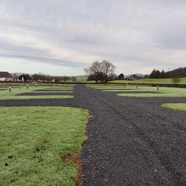 Gravel pitch beside the trees