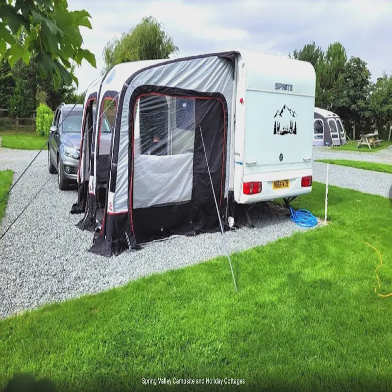 Caravan with awning on grass