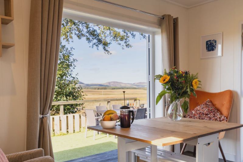 Dining table by the open doors