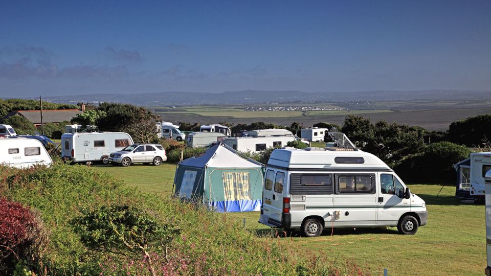 Motorhome beside a tent