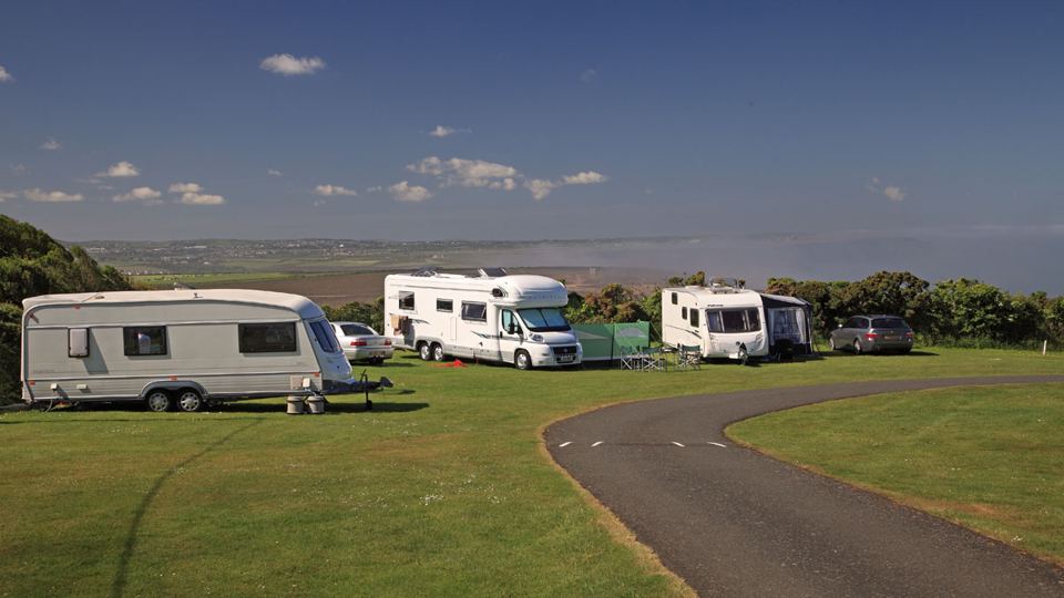 Caravans and motorhome on grass