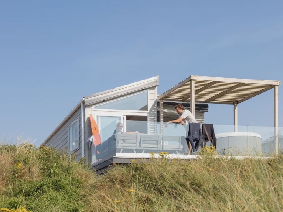 Lodge with pergola and hot tub