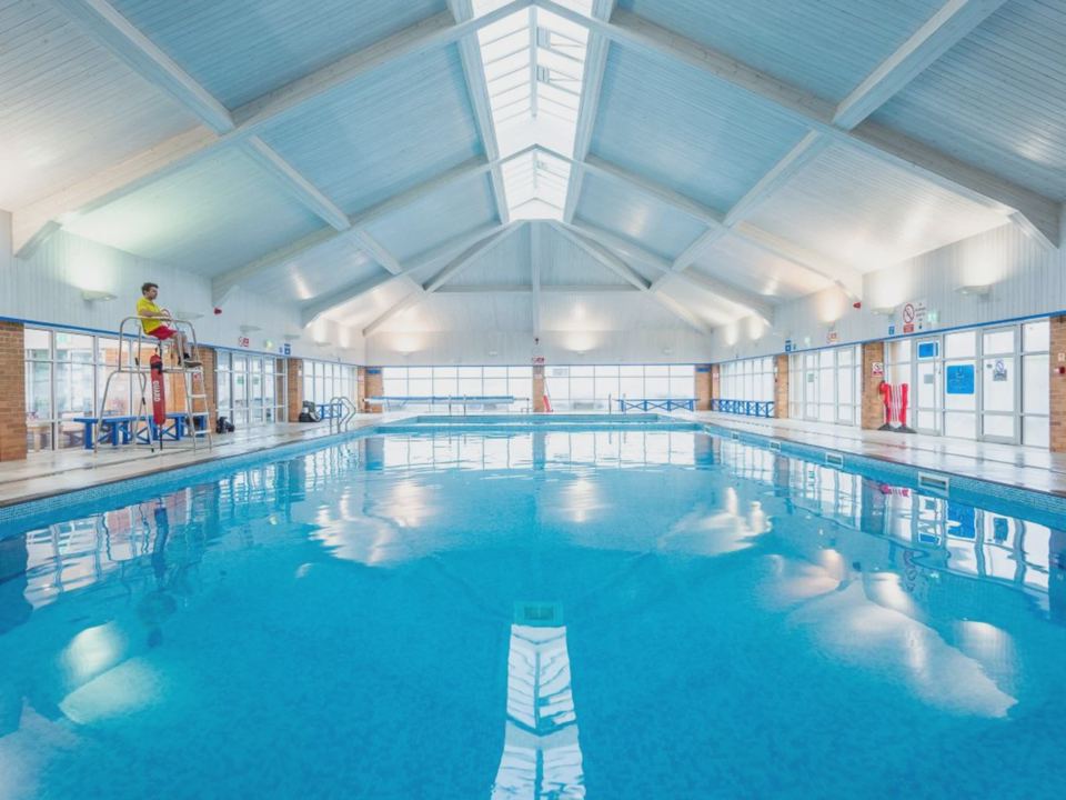 Indoor pool with lifeguard chair