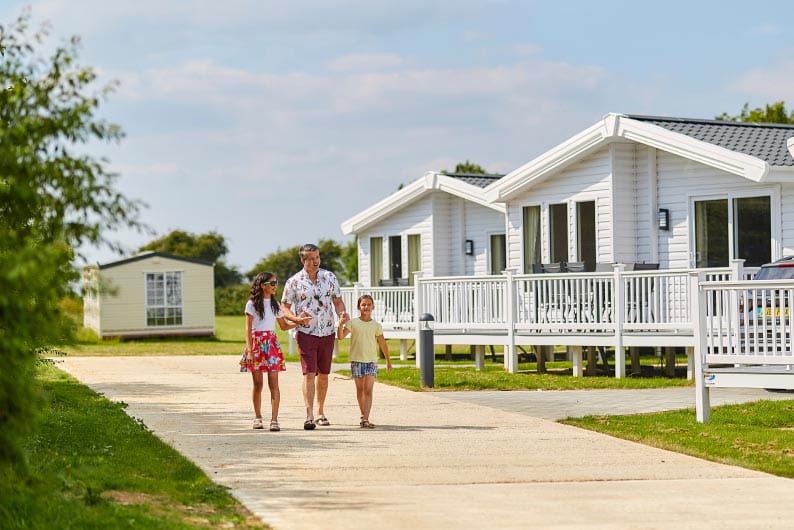 White lodges with decking