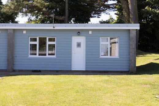 Blue lodge exterior on the lawn