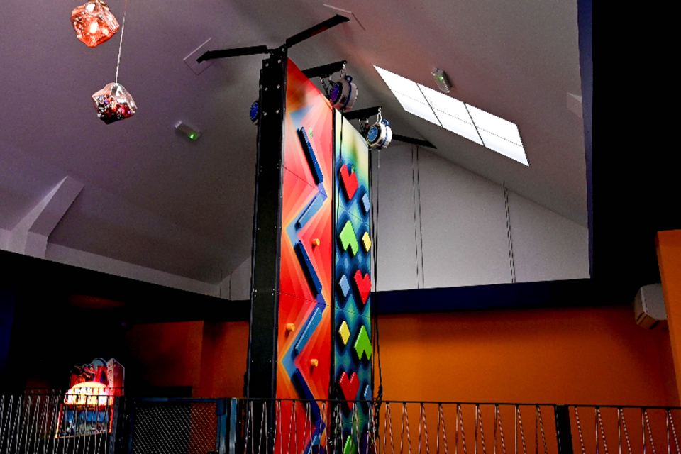 Climbing wall and arcade