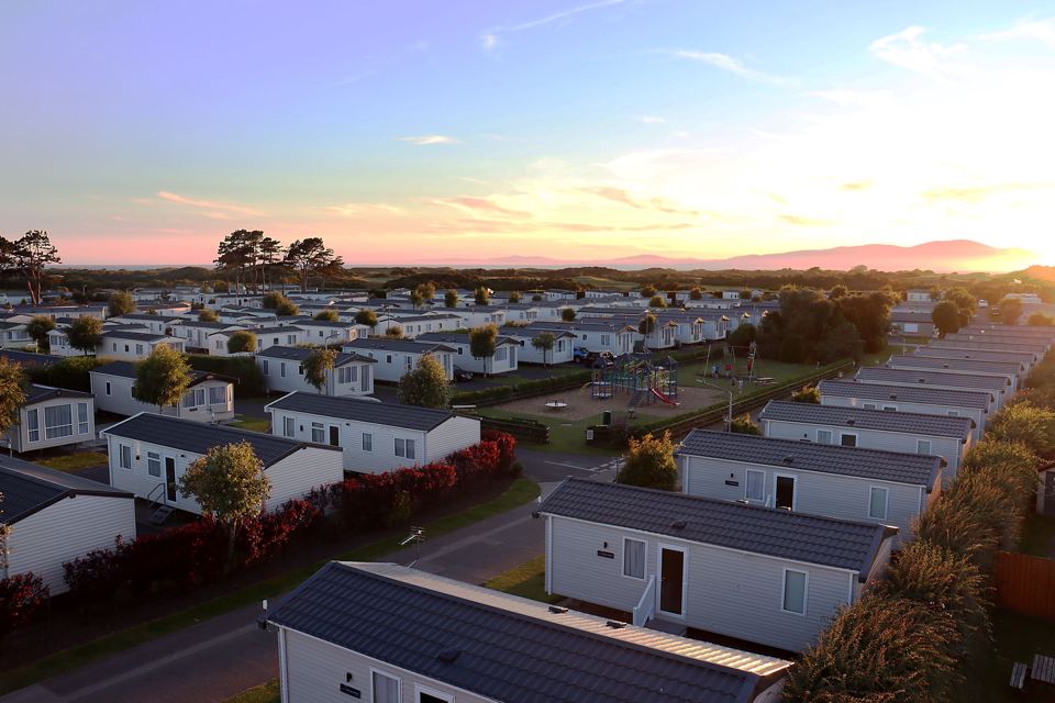Caravan holiday homes at sunset