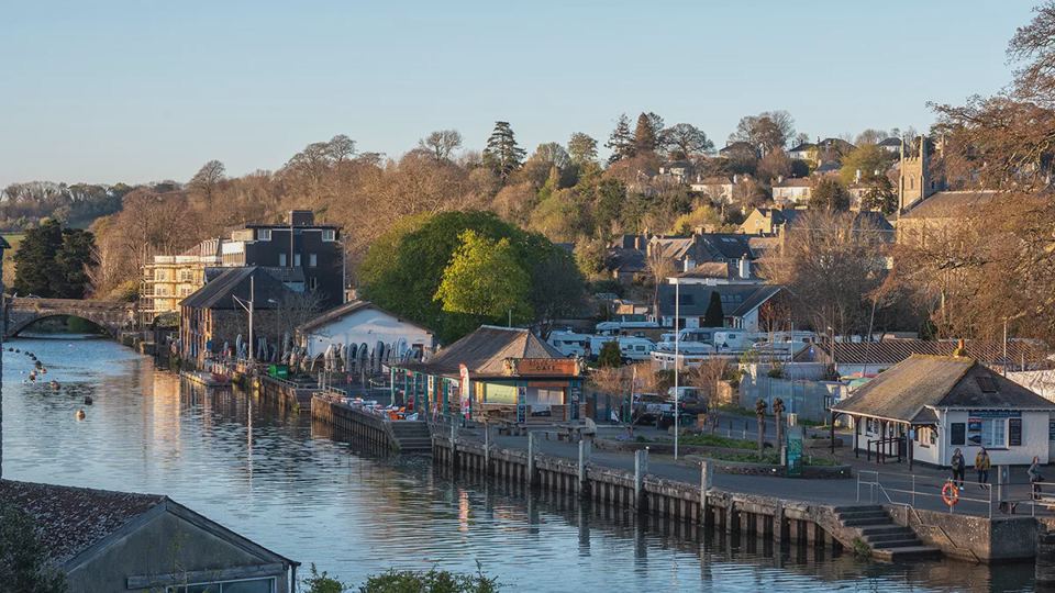 Riverside houses and boat sheds