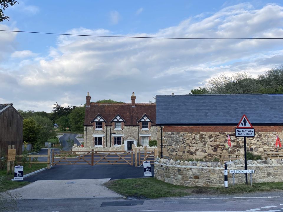 Farmhouse and site entrance