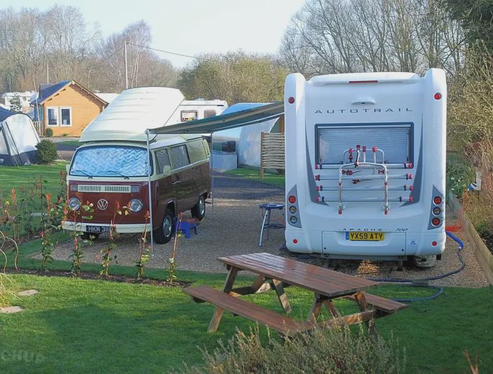 Campervan and motorhome on hardstanding