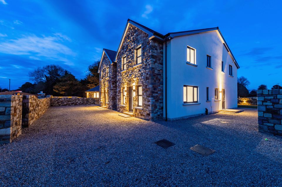 Stone-fronted lodge at dusk