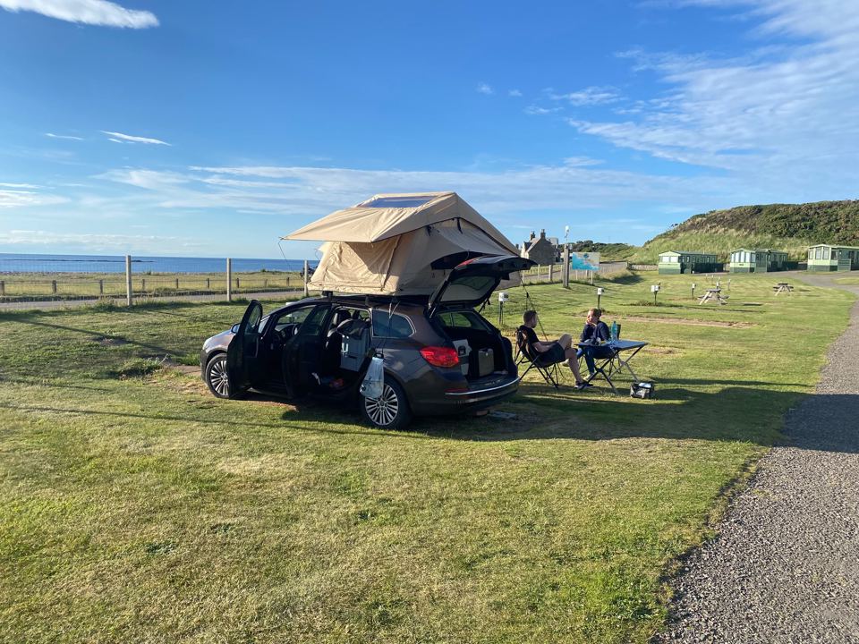 Rooftop tent by the sea