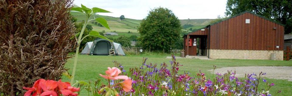 Tent on the grass by the barn