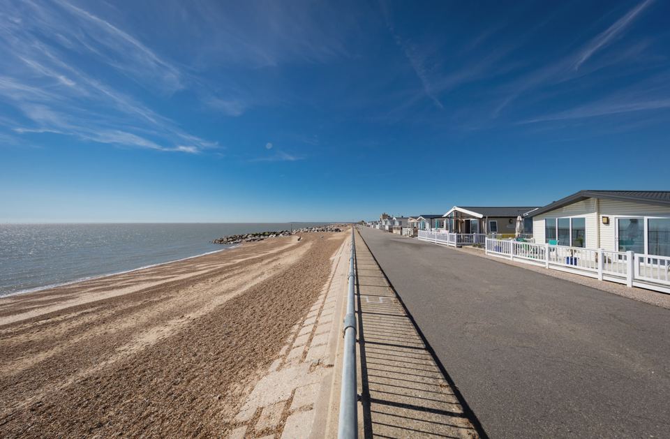 Sea wall and shingle beach