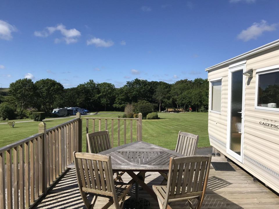 Static caravan with deck