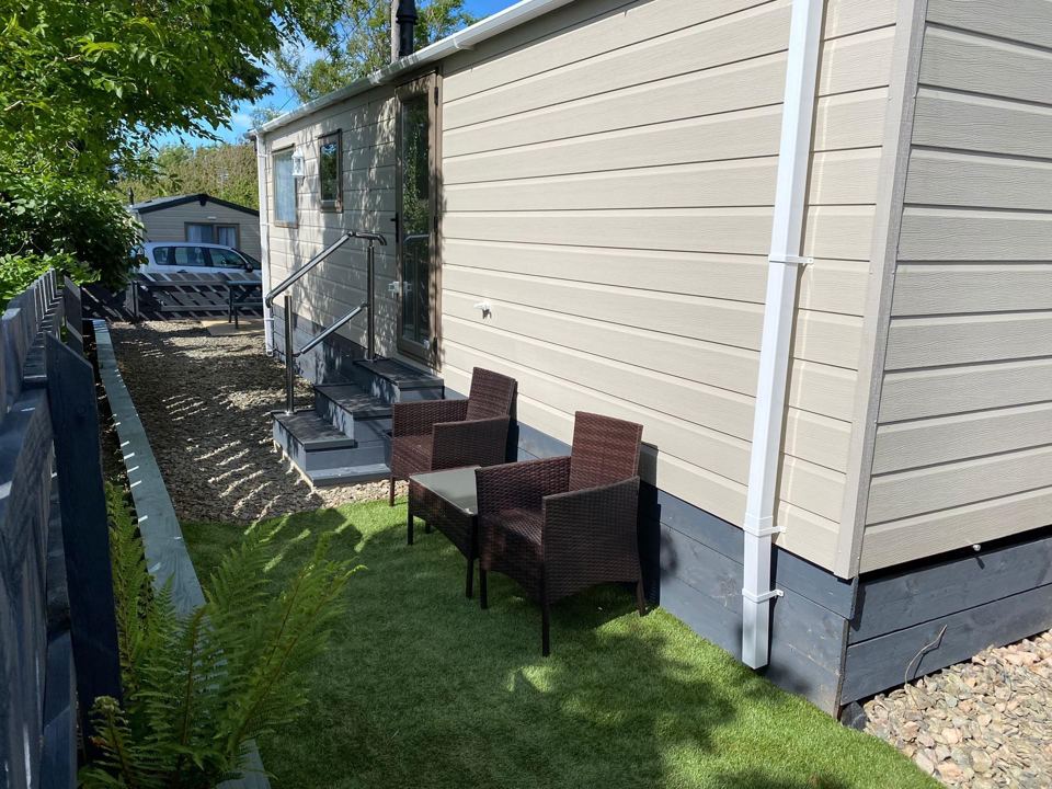 Static caravan with garden seating