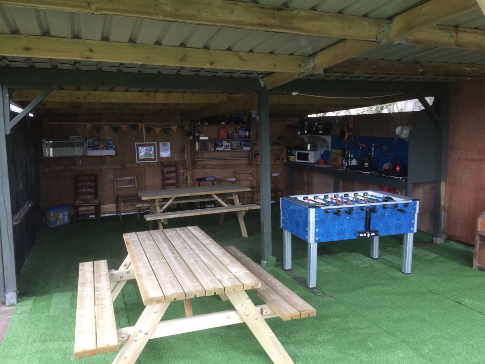 Covered communal kitchen with table football