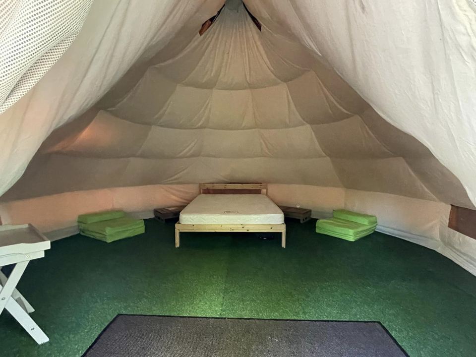 Inside a furnished bell tent
