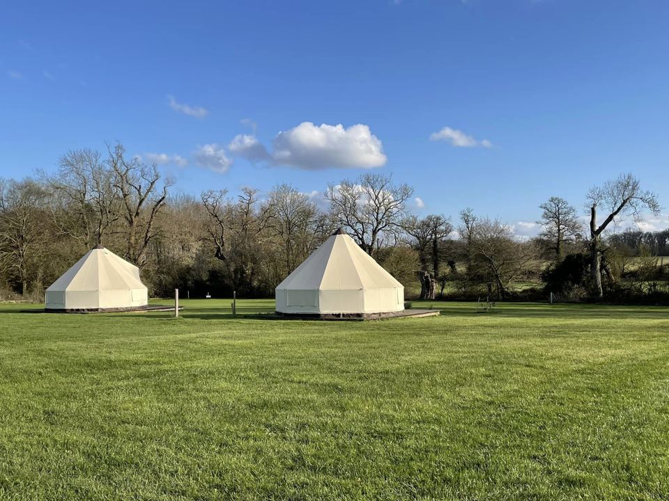 Two bell tents on the grass