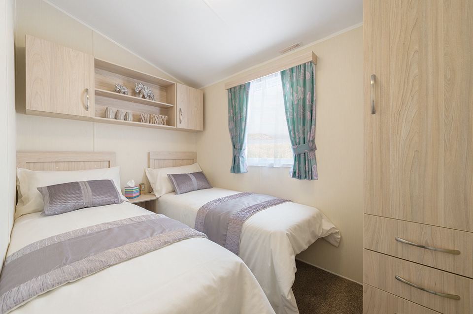 Twin bedroom in a holiday caravan