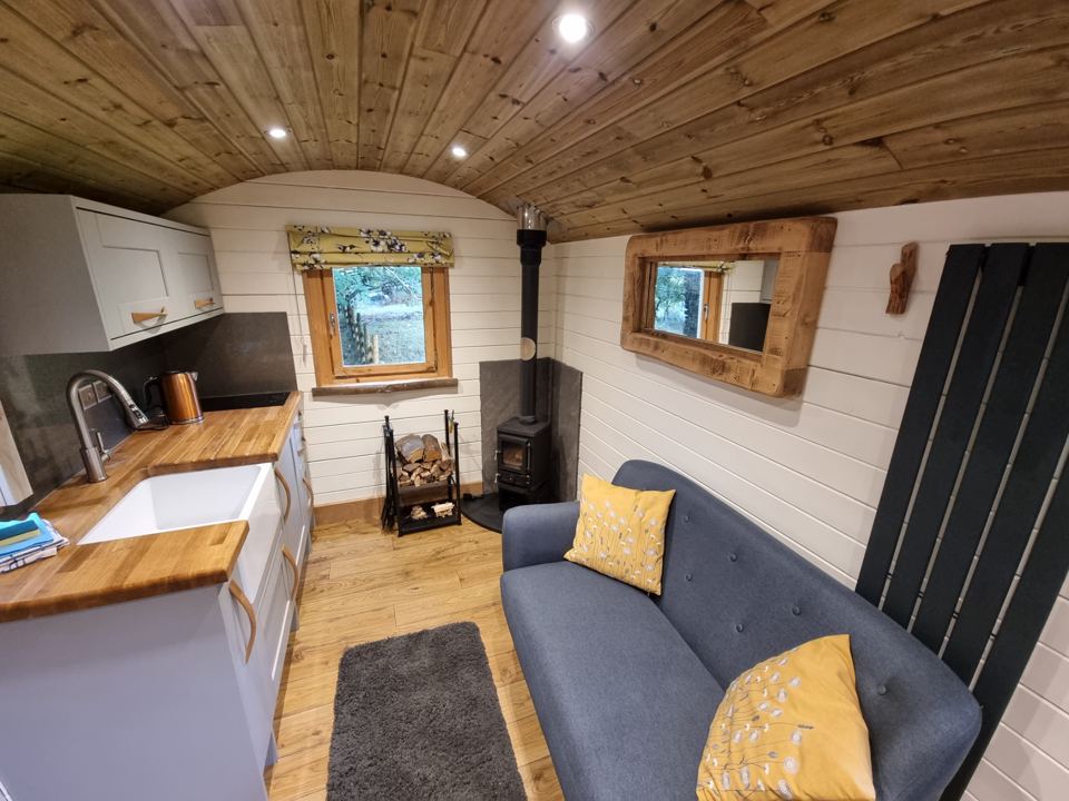 Sofa and sink inside the hut