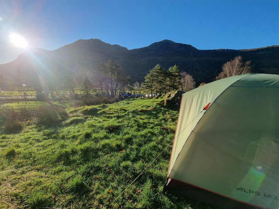 Tent in the field by the fells