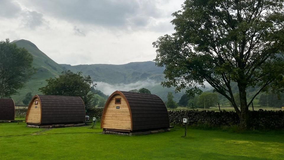 Pods on the grass below the fells