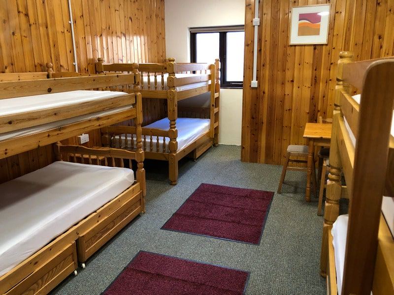Bunk room with wooden beds