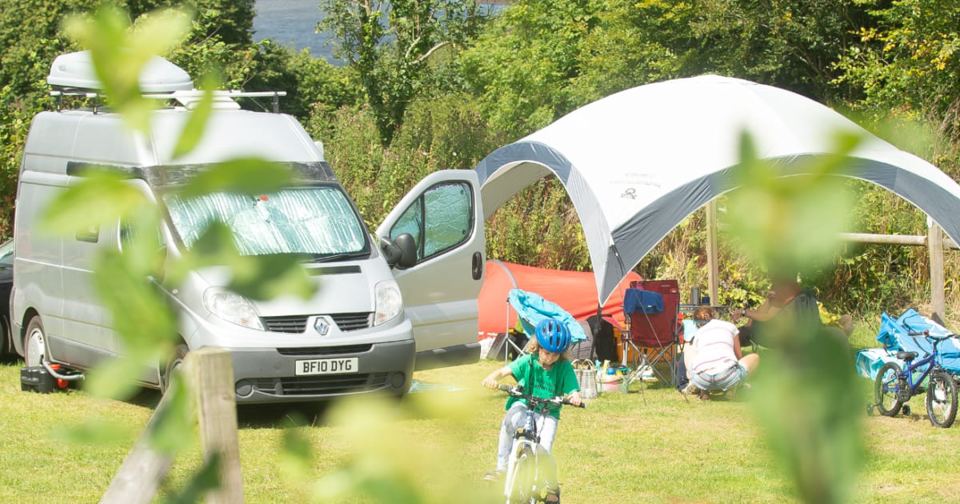Campervan and awning on the grass
