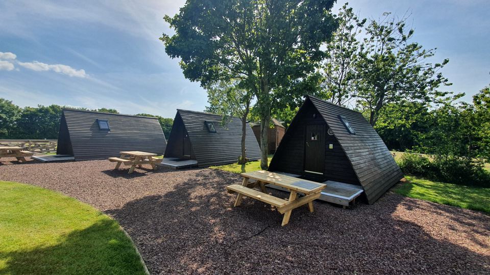 Wigwams with picnic tables