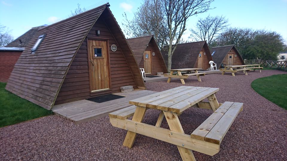 Wigwam row with picnic bench