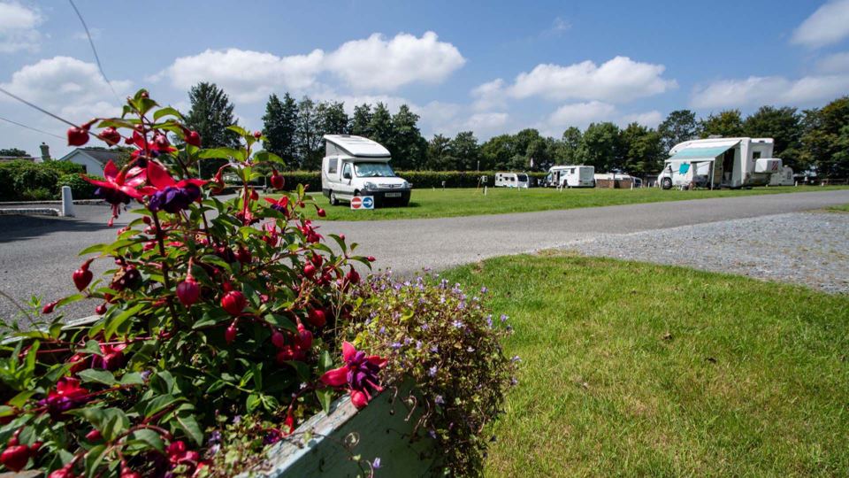 Motorhome and caravan on grass pitches