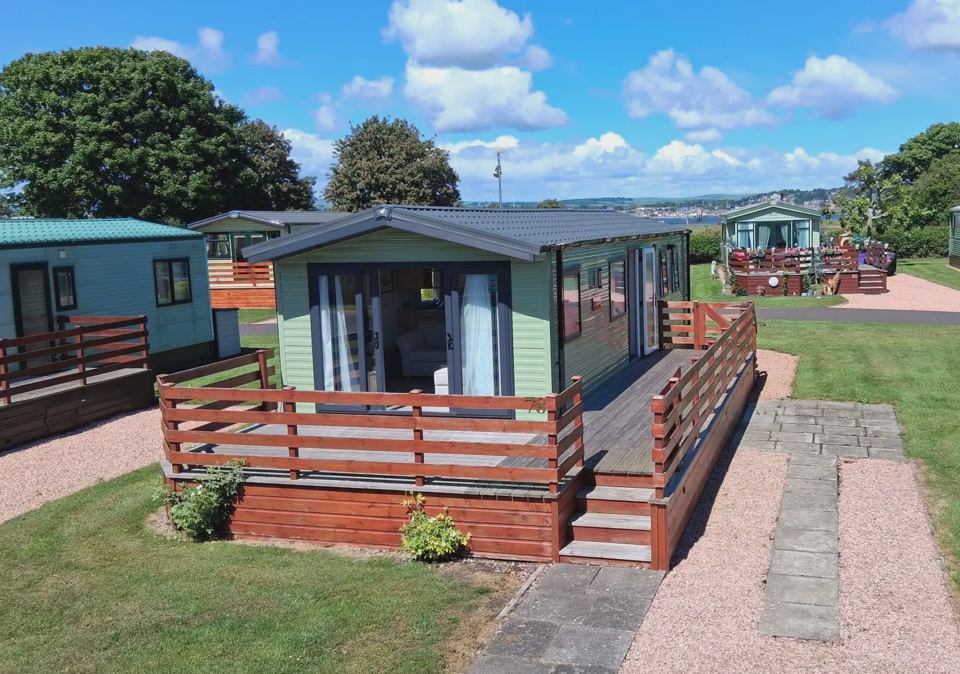 Caravan with decking and path