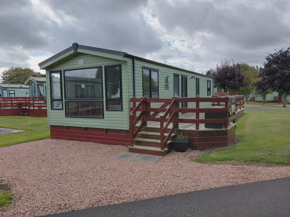 Static caravan with gravel parking
