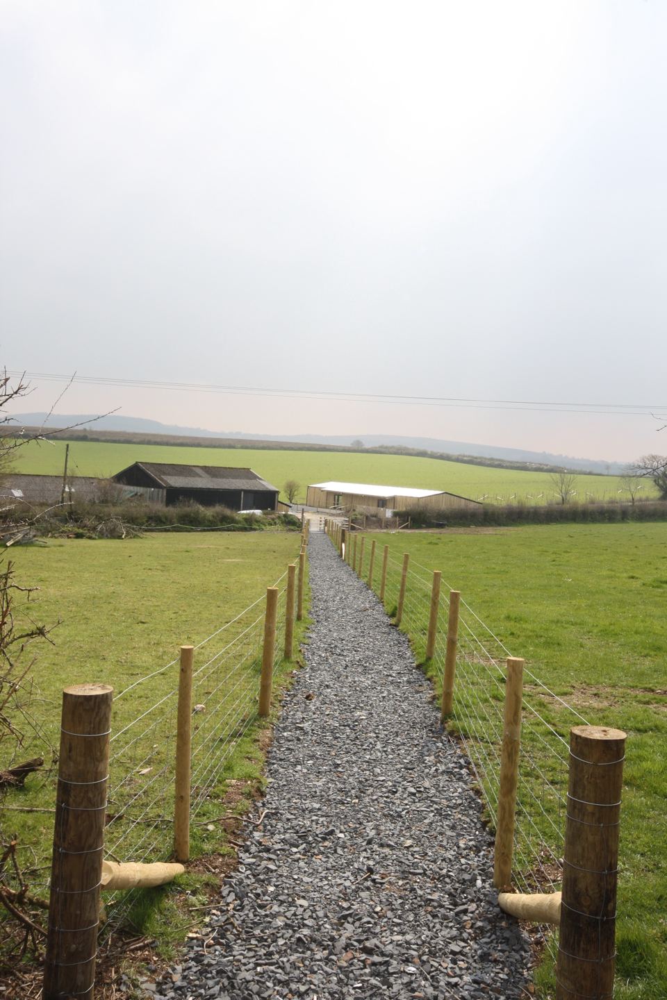 Gravel path between the fences